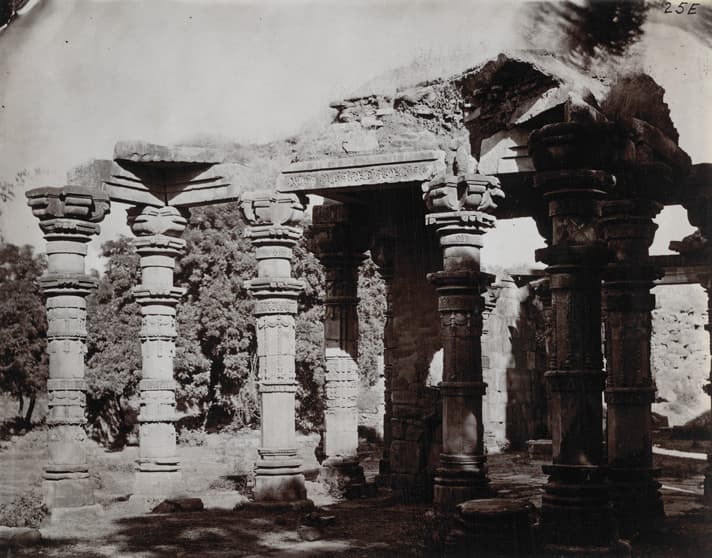The Quwwat ul Islam pillars: Carved temple pillars standing in the colonnade of the Quwwat ul Islam mosque at Delhi, photographed in 1870.